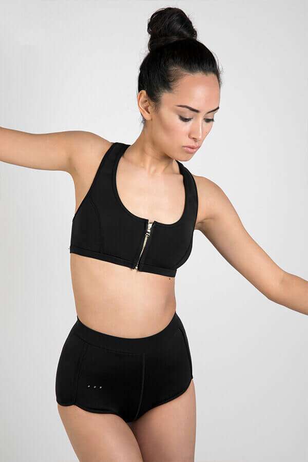 Scoop zip front sports crop bikini top made with Yulex + High waisted sustainable surf shorts (studio)