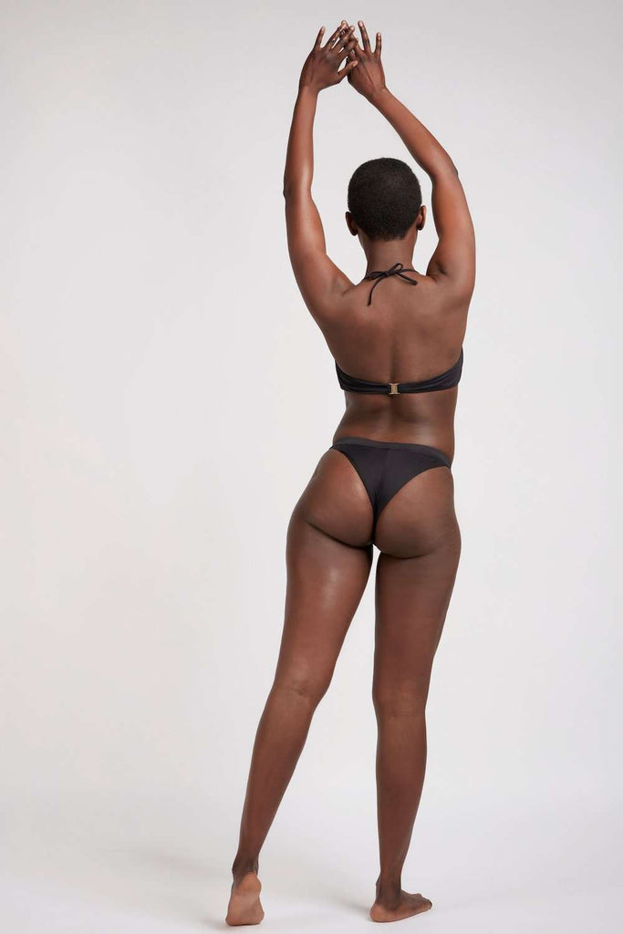 Sustainable cheeky thong bikini bottom and bandeau top (behind) in black for surfing and yoga BLACK - sustainable swimwear