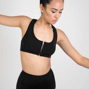 Scoop zip front sports crop bikini top made with Yulex + High waisted sustainable surf shorts (studio)